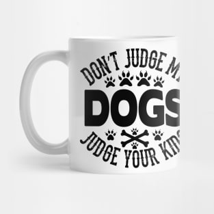 Don't judge my dogs judge your kids Mug